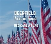 Flags in the background with wording saying "Deerfield Field of Honor" and "Dedicate a Flag"