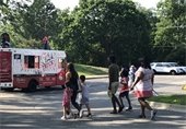 People walking to a food truck