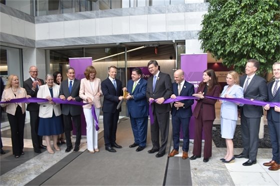 Local officials cutting a purple ribbon at Vantage