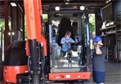 Child and dad at the touch a truck