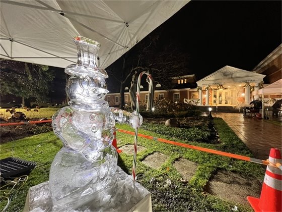 Photo of a snowman ice sculpture in front of Village Hall