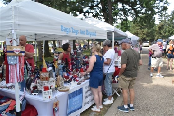 Shoppers at a booth at Family Days