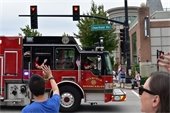 Photo of people waiving to a fire truck in the Family Days parade
