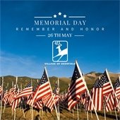 Photo of flags in a field with a blue sky with the words "Memorial Day: Remember and Honor